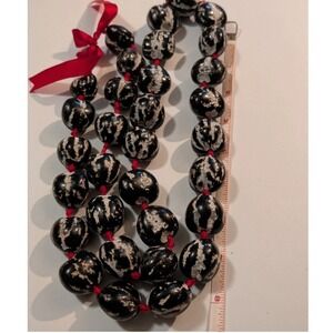 Hawaiian Kukui Nut Lei Necklace Polished Black White Mottled Red Ribbon 36 Inch